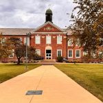 A brick building with a clock tower on top of it
