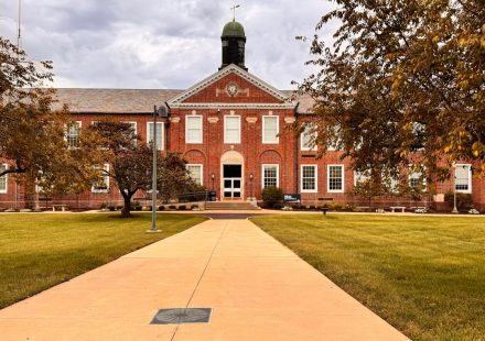 A brick building with a clock tower on top of it