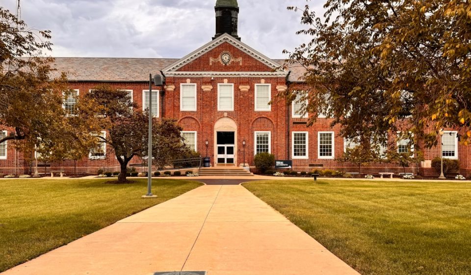 A brick building with a clock tower on top of it
