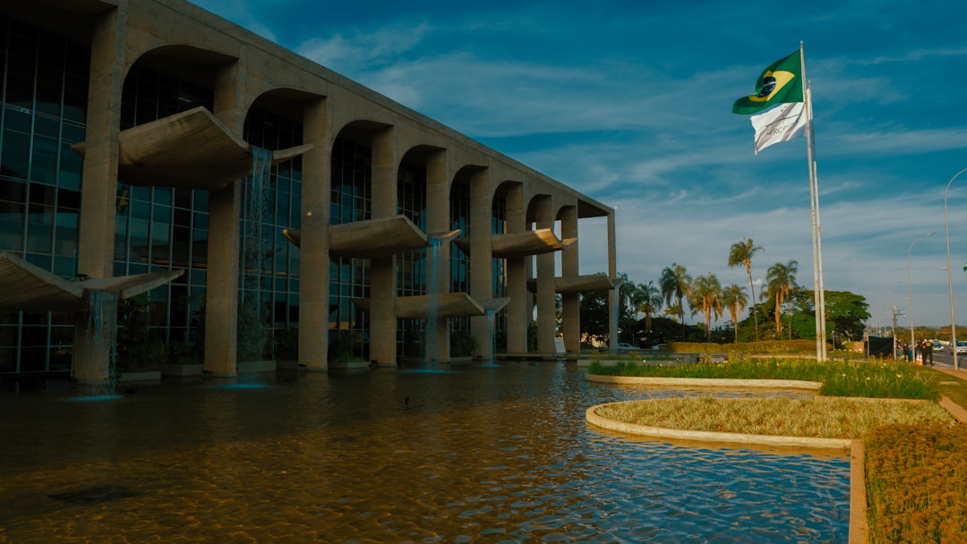 Brazilian government building and national flag for medical cannabis regulation coverage