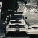 Traffic on an Australian urban road beside give way and speed limit signs