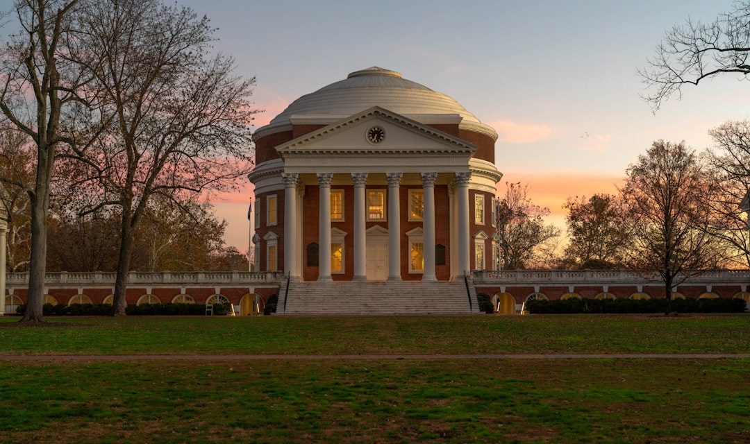 a building with a dome in the middle of a field